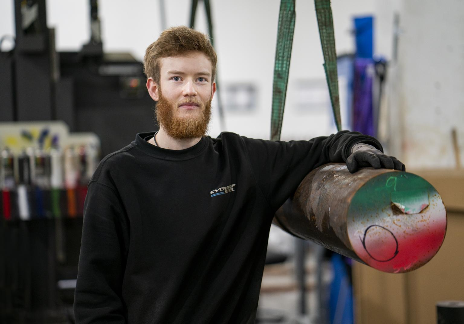 Our employee next to a steel beam