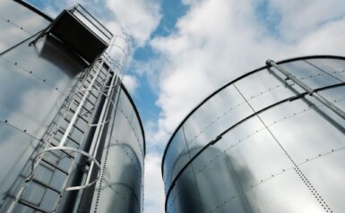 Steel storage tanks seen from below
