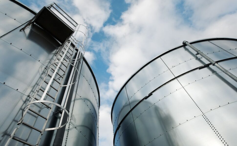 Steel storage tanks seen from below